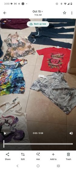 Assortment of brand new, women's, high quality dresses, shirts, pants and jacket, with tags still on them.