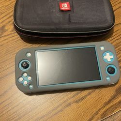 Nintendo Switch Lite W/ Super Smash Bros Game