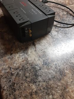 Battery backup surge protector