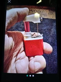 One overkind hand held sewing machine.