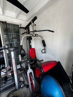 Indoor cycling bike and upper body weight machine