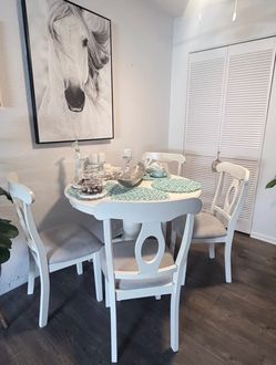 Table with 4 chairs stain-resistant fabric.