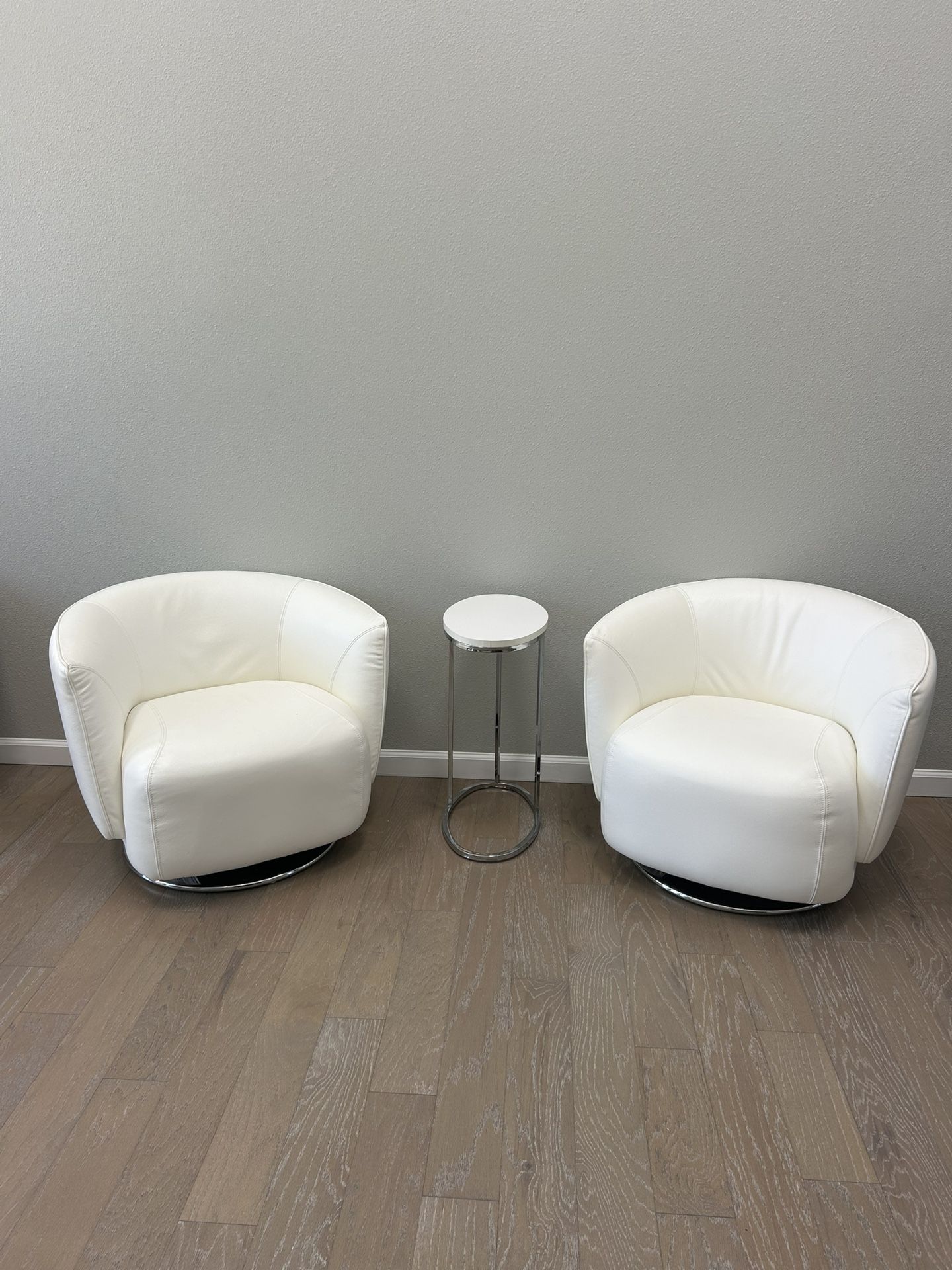 2 Leather Swivel chairs