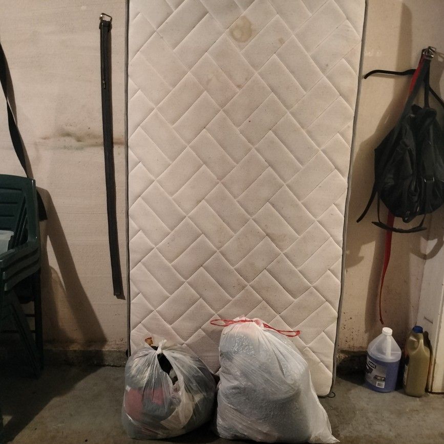 Free Twin Mattress And Two Bags Of Kids Clothes 