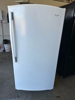 Upright freezer Medium size works great 30 inches wide 60 inches tall 27 1/2 inches deep