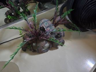 Stacked wooden-style barrels with attached artificial green and purple foliage for fish tank