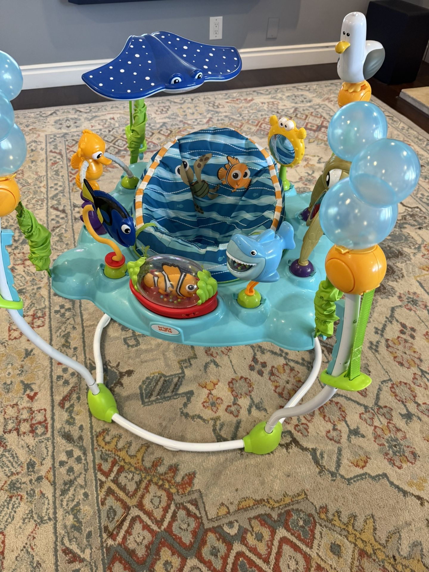 Bright Starts Disney Baby Finding Nemo Sea of Activities Baby Activity Center Jumper with Interactive Toys, Lights, Songs & Sounds, 6-12 Months (Blue)