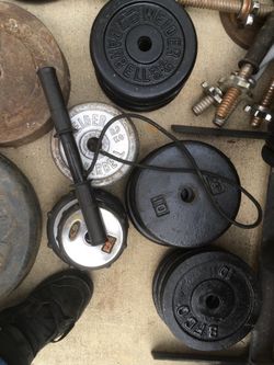 Many 1” standard weight plates metal