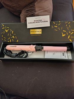 Wavy rotating curling iron