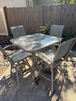Outdoor Patio Bar Height Table and 4 Chairs and umbrella stand