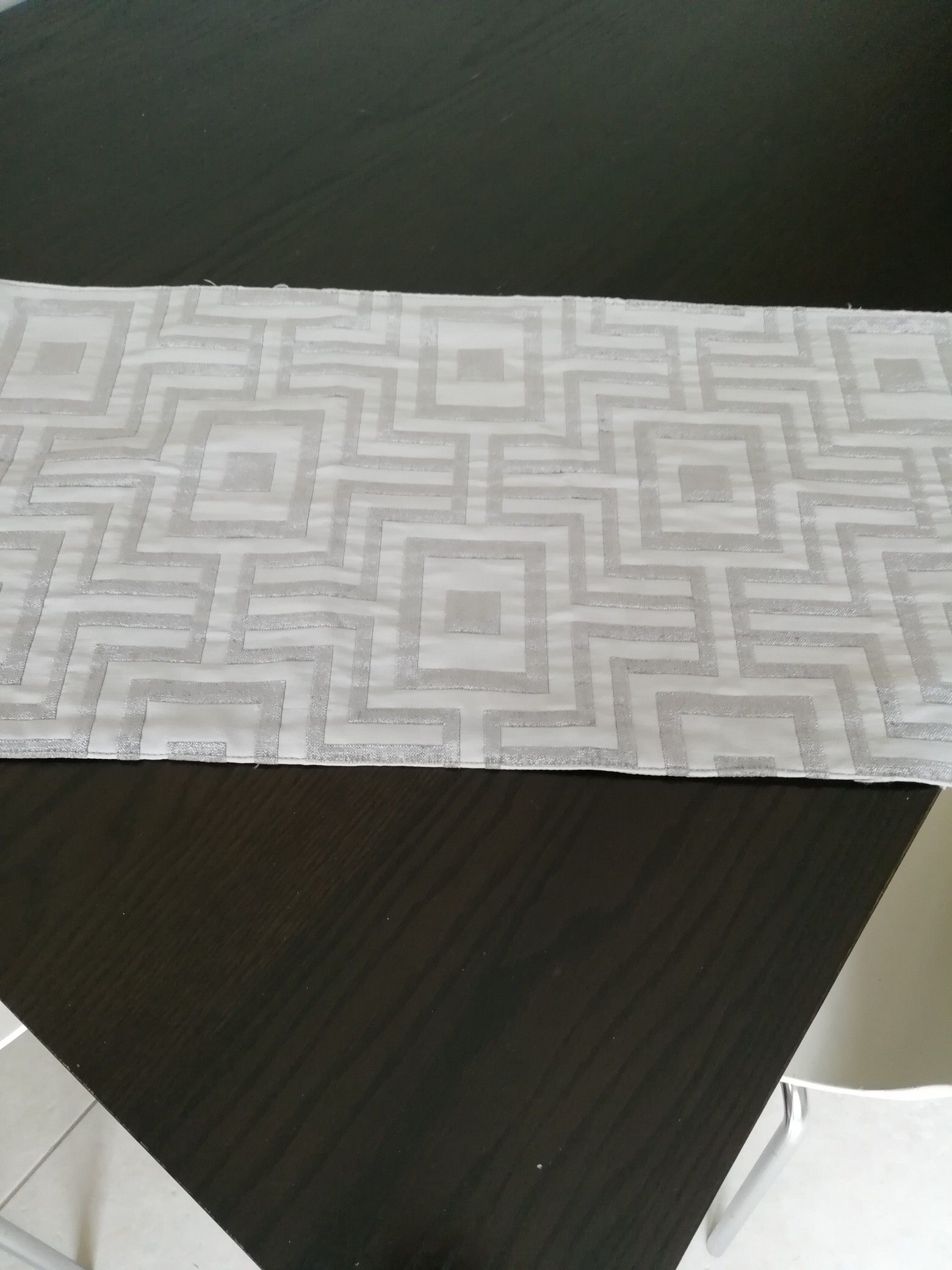 Silver grey contemporary table runner with a dynamic geometric design for a modern home decor 14'70'