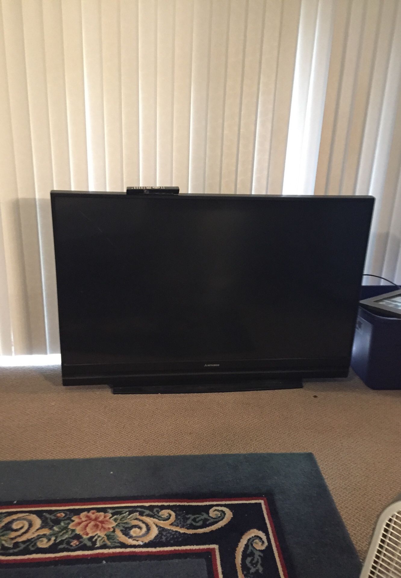 60 projection tv -works but has many little white dots on the screen