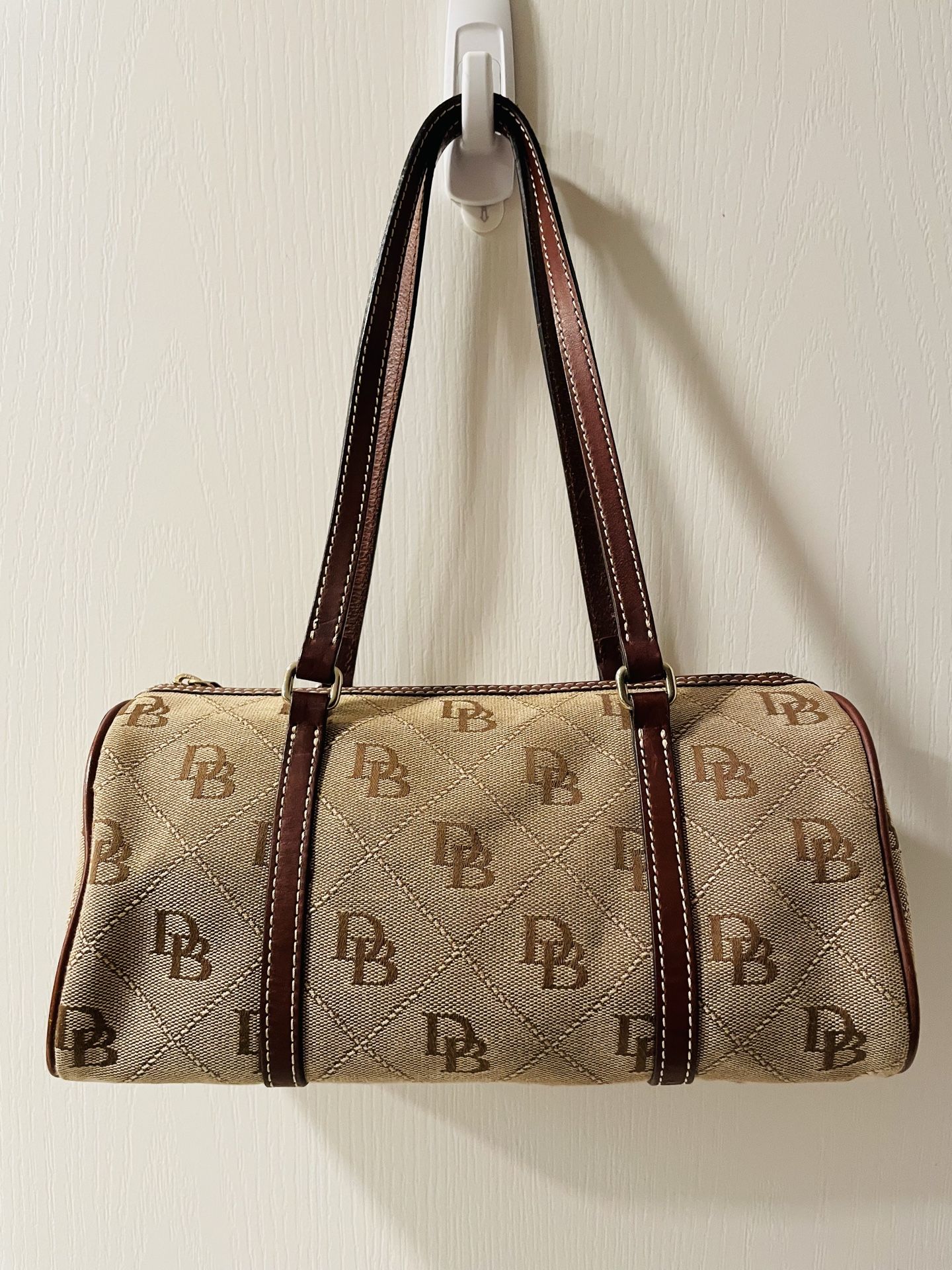 Vintage Dooney & Bourke signature brown mini barrel bag with leather trim and classic logo