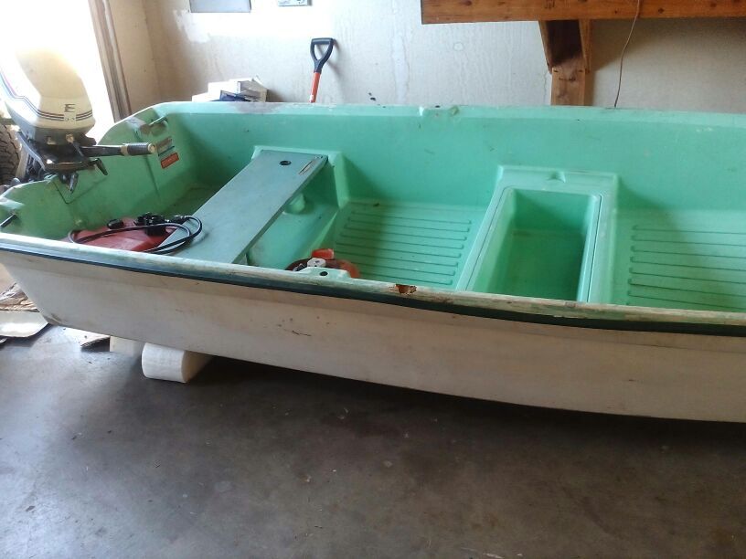 12 ft. Fiberglass sears roebuck row boat with motor