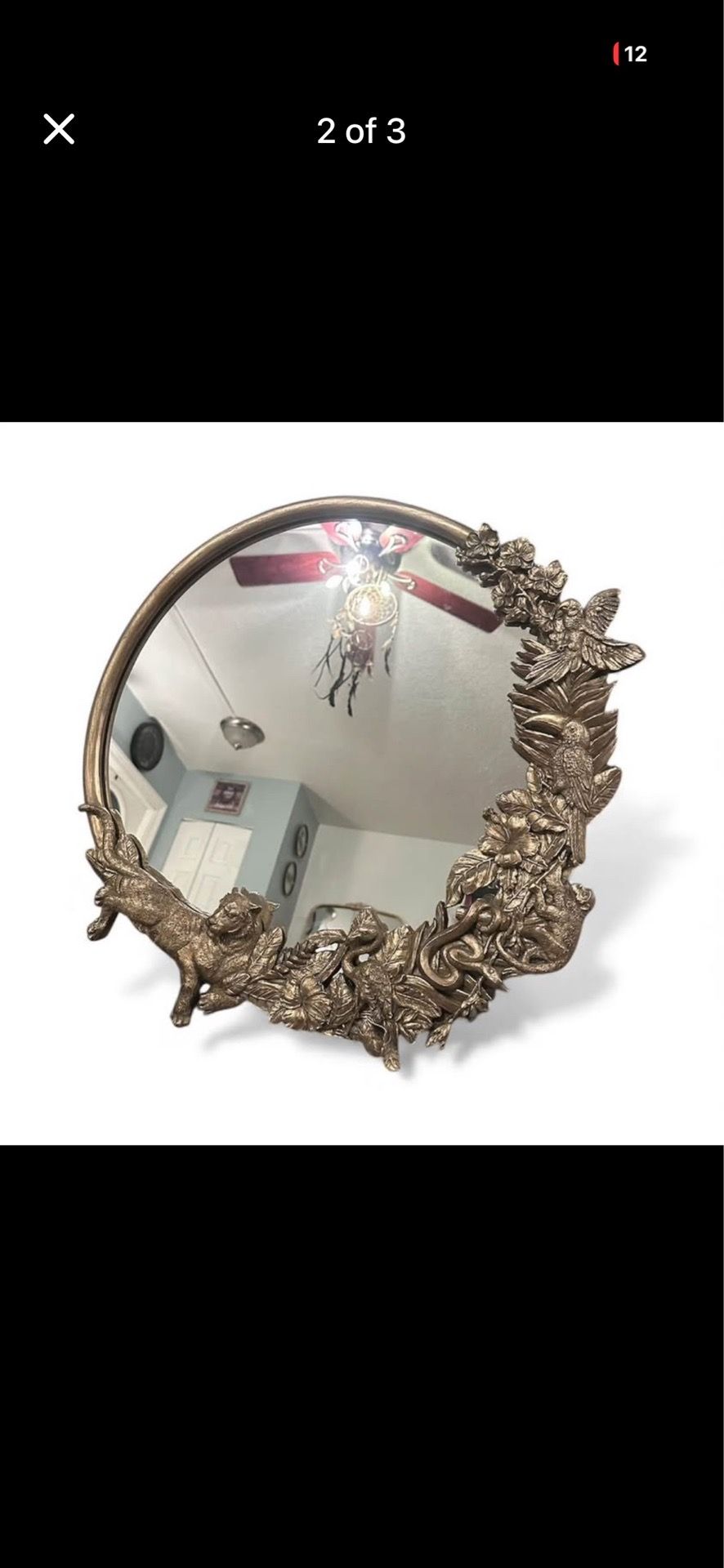 Victorian style gold framed mirror with jungle animals