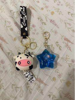 Cow Keychain and Sanrio Tuxedo Sam Keychain