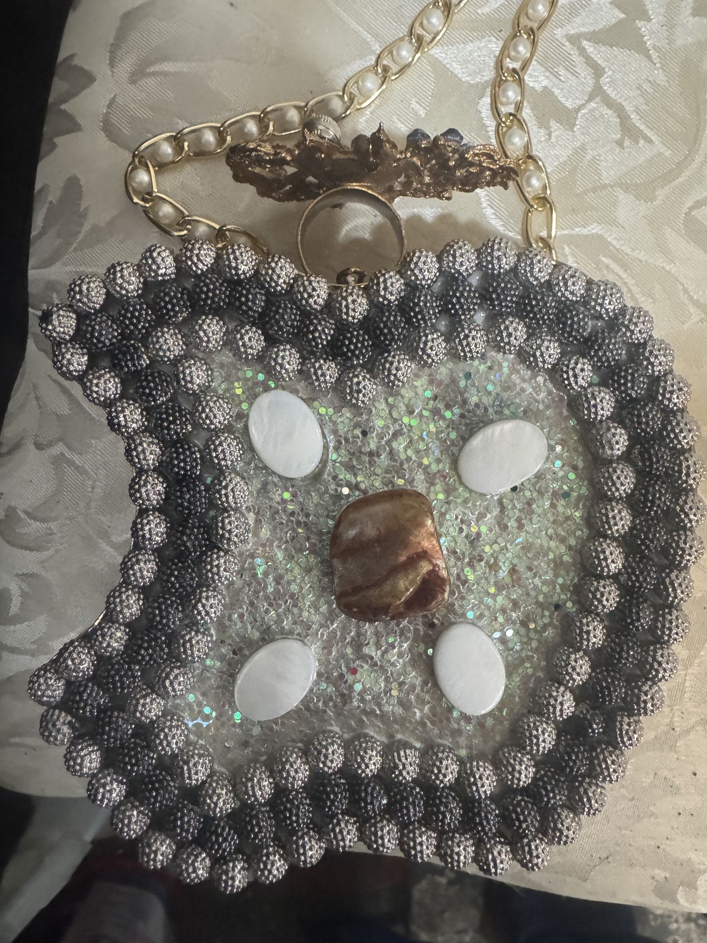 This is a vintage beaded evening bag with earrings.