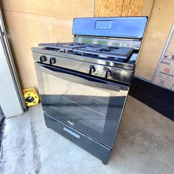 Whirlpool gas stove 4 burners black color.  30”