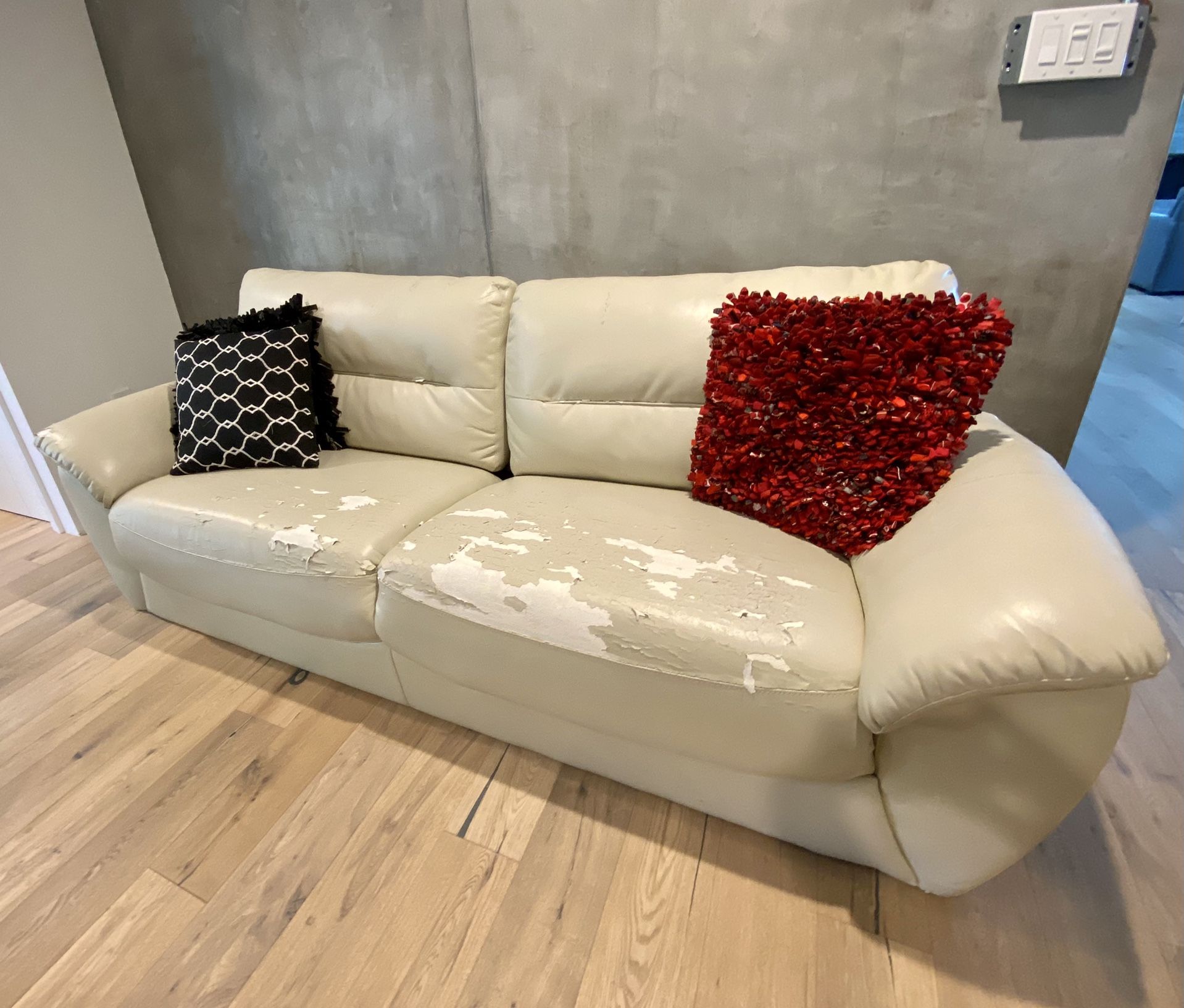 Faux Leather Sofa, Very Comfortable needs a cover