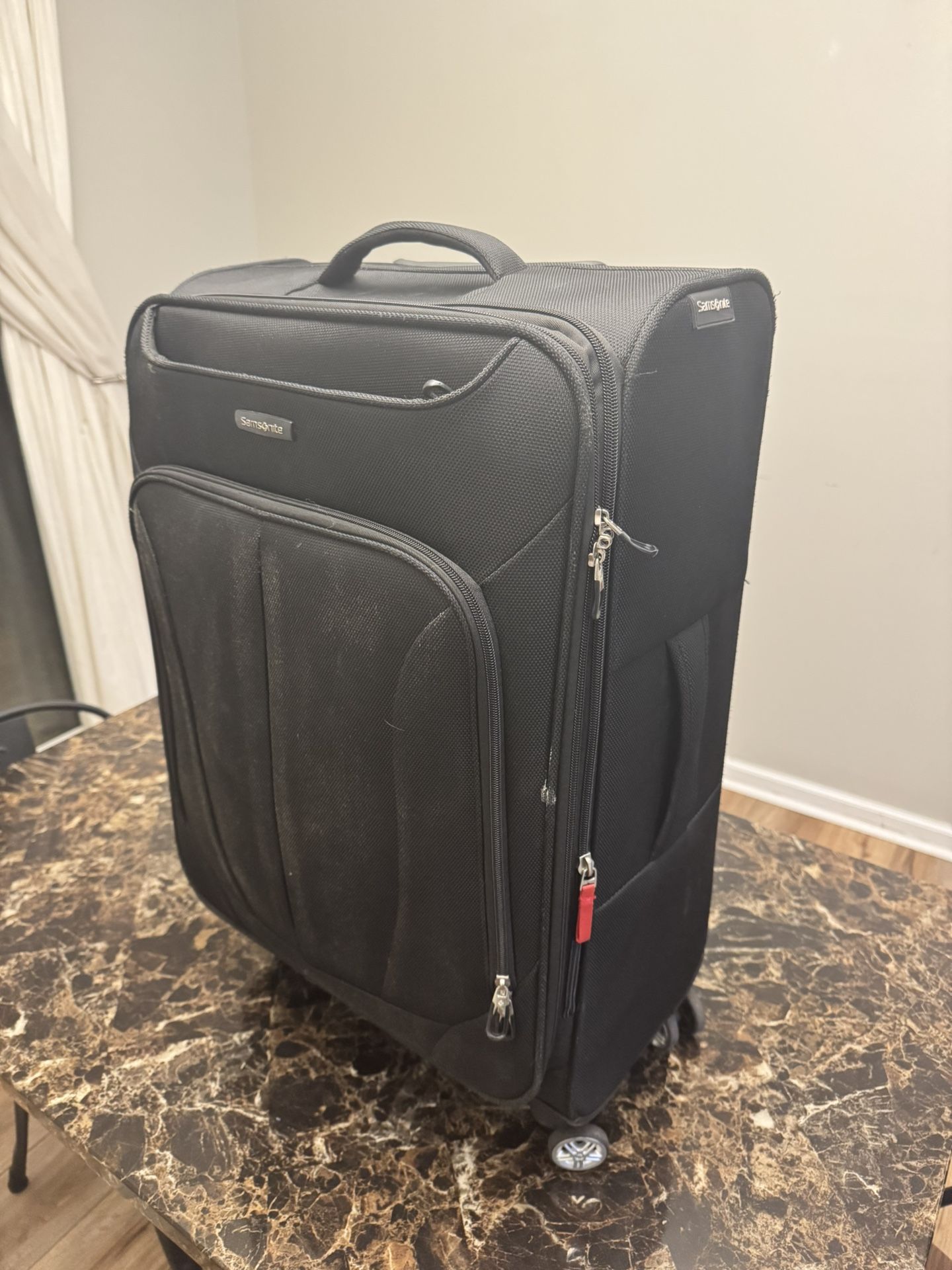 Medium Samsonite luggage