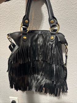 black leather fringed handbag, resembling a bohemian-style hobo or top-handle bag with layered fringe tiers and gold-tone hardware.