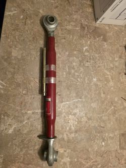 Ractor top link assembly