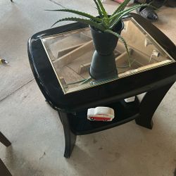A Mirrored Top End Table With A Bottom Tier Also 