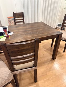 Solid wood dining table and 6 chairs from Macys