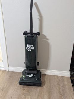 Vintage green Dirt Devil Featherlite upright vacuum cleaner
