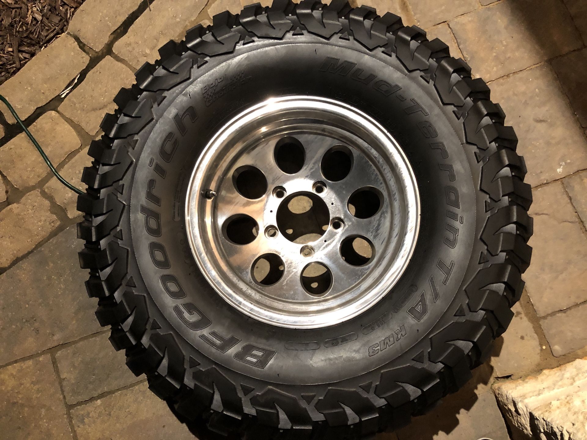 One 15”x7” wheel w 33x12.5x15 BF Goodrich Mud terrain KM3 tire (spare)