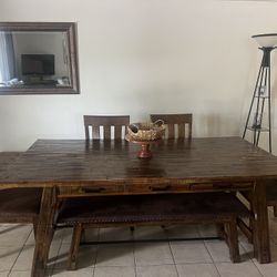 Beautiful all Wood Dining Table with four chairs and bench. Matching Buffet  Sold Seperately. 