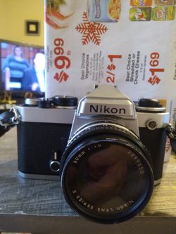 VINTAGE NIKON FE,,WITH NIKON LENS SERIES E,SKYLIGHT FILTER..