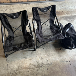 Four low back chairs and carrying bags