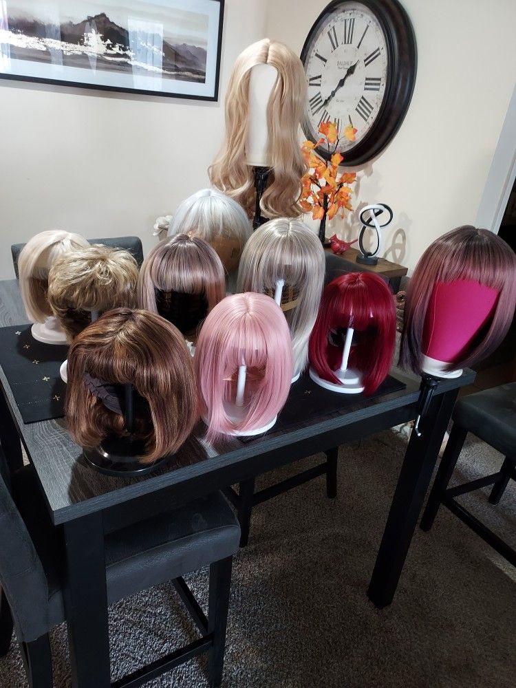 PRICED TO SELL 11 NEW UNUSED WIGS WITH 9 STYLINGSTANDS