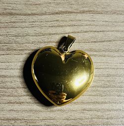 gold heart pendant designed for everyday wear. Polished gold finish for a classic, reflective look. Lightweight and versatile to pair with any