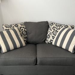 Gray and beige love sofa