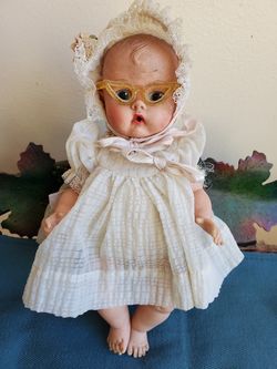 Vintage soft plastic doll with glasses