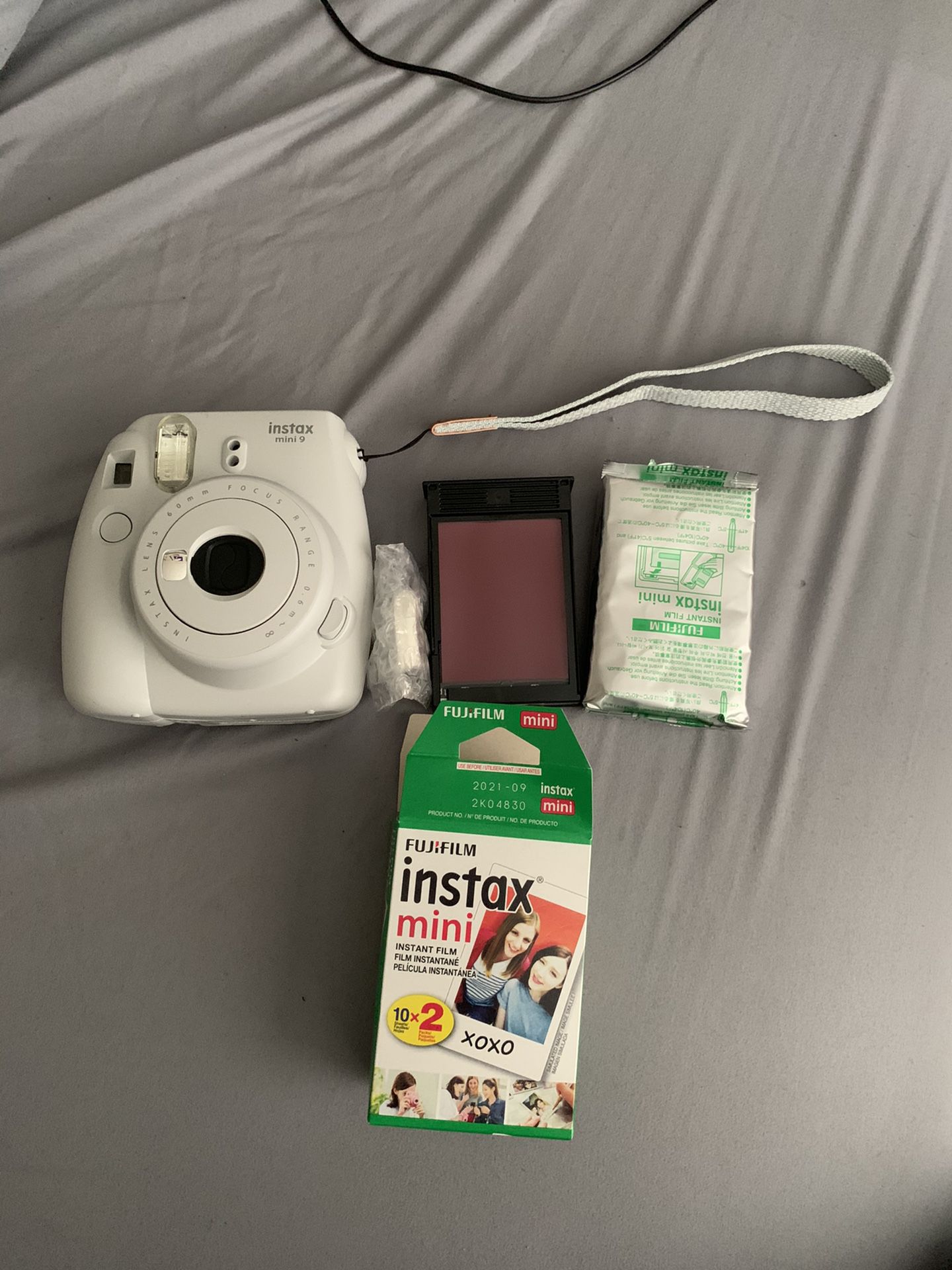 Polaroid camera with film