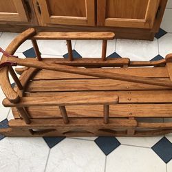 Handcrafted solid oak Childs pull behind sled, 29” long X 14” wide 12” high excellent condition
