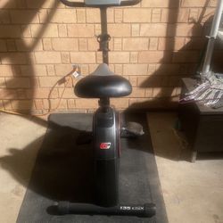 Pro-form 135 CSX Upright Exercise Bike With LCD Display And 12 Lbs Flywheel, 4  Position Adjustable Seat , Good Condition