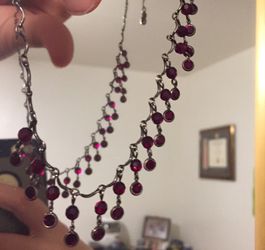 Necklace with red toned beads