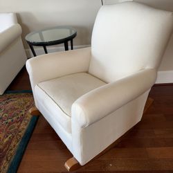 Two upholstered rocking chairs, plus ottoman.