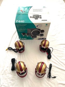 Brand new in the box (Logitech Z-640) surround sound speaker system with 49ers mini football helmets