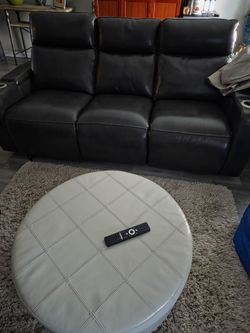 Two leather reclining sofas