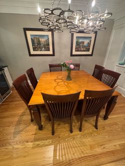 Beautiful solid wood dining room table and 8 chairs