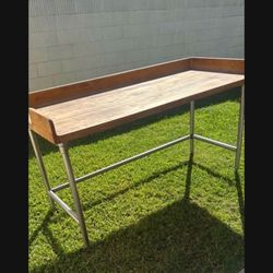 BUTCHERS BLOCK TABLE..BACKSPLASH COMMERCIAL . Stainless steel legs.72x41x30” $300