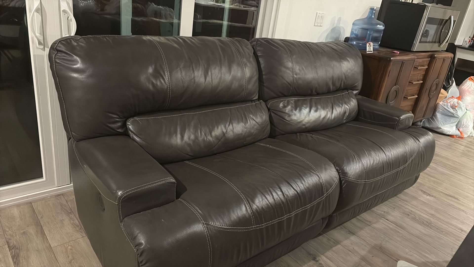 Grey reclinable leather Couch With Loveseat also reclinable (new Price)!!!