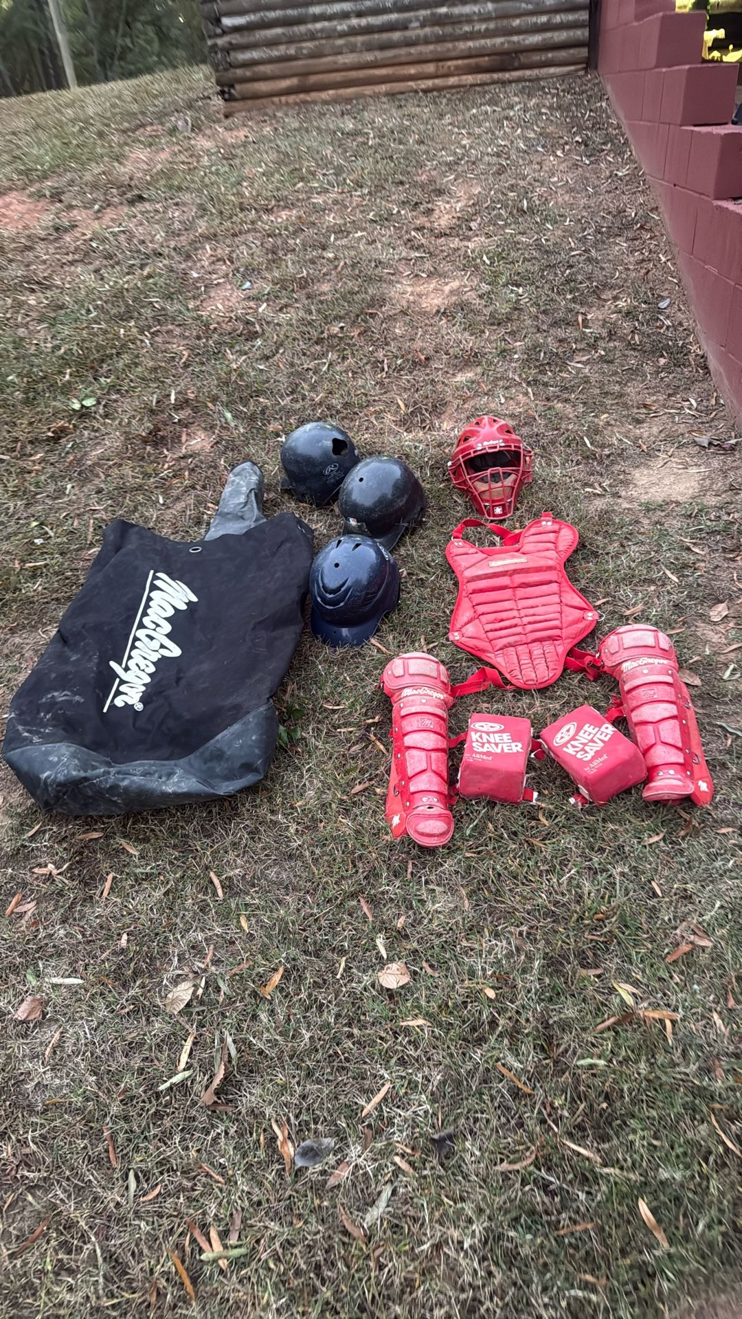 Baseball equipment, catchers gear, three helmets and utility bag
