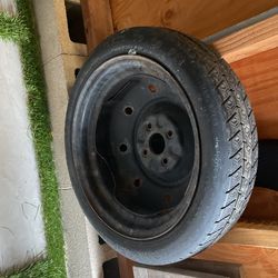 Temporary use spare tire for Toyota Corolla. 4 bolt pattern. Never used