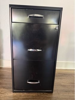 Metal file cabinet with lock and keys